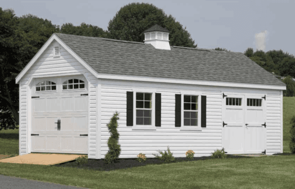 12 by 24 Colonial Garage with New England upgrade and optional carriage-style garage door, white vinyl siding, white trim, slate roof, black shutters.
