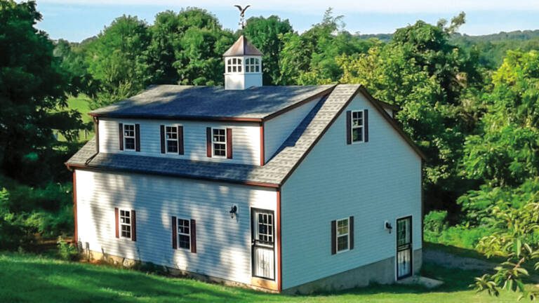 G83 | 24x32 Two-Story Garage with 10' walls and a shed dormer.